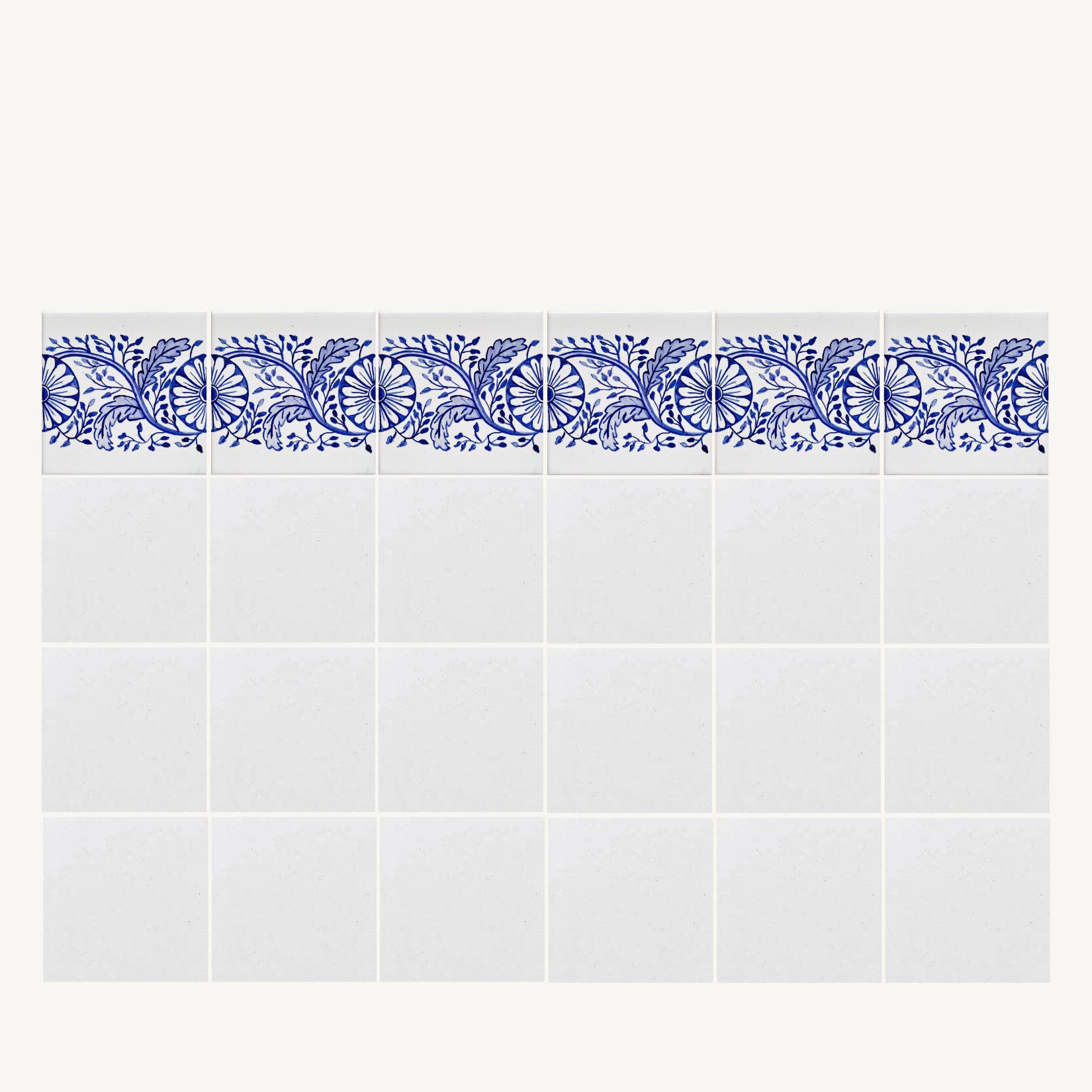 ściana białych kafli zwieńczonych linią kolorowej bordiury z wzorem